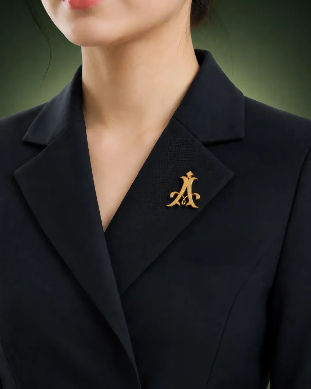 An Aureaux chauffeur wearing the gold monogram lapel pin