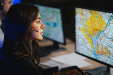 An Aureaux logistics specialist tracking routes in the control room